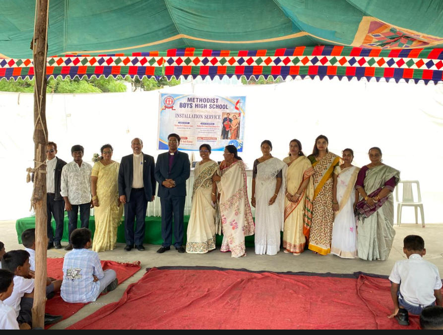 School community members gathered on stage during the installation service